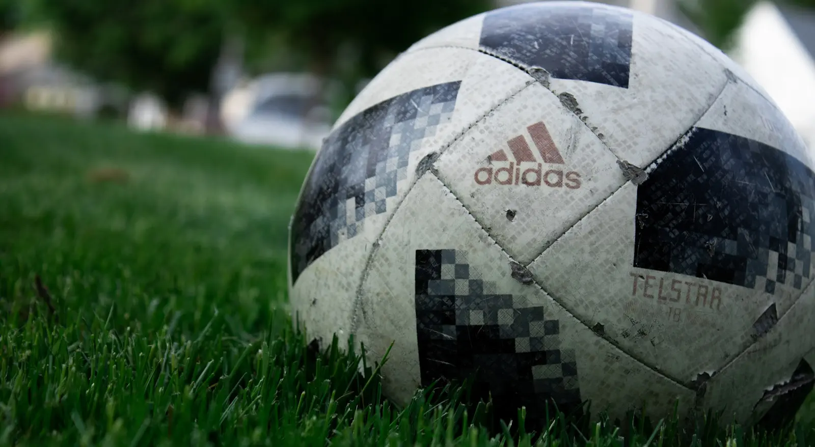 Photo by Jason M a close up of a soccer ball in the grass